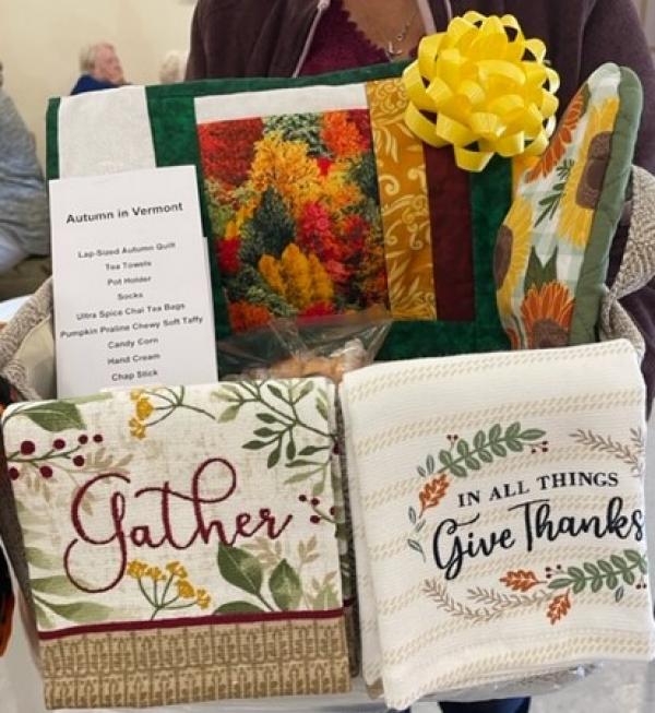 A beautiful Autumn basket with a handmade lap quilt and numerous Fall items was a big hit at the auction.